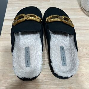 Charles and Keith mules with fleece and buckle accent. Ladies size 39 ( 8-8.5)